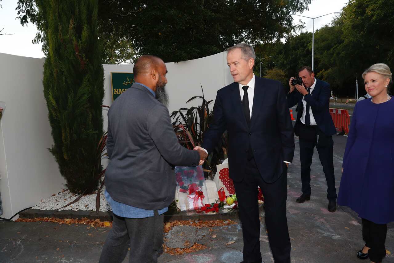 Australian opposition leader Bill Shorten and his wife Chloe Shorten meet mosque member Naseem outside the Al-Noor Mosque in Christchurch, New Zealand, Friday, March 29, 2019. (AAP Image/New Zealand Herald Pool, Dean Purcell) NO ARCHIVING