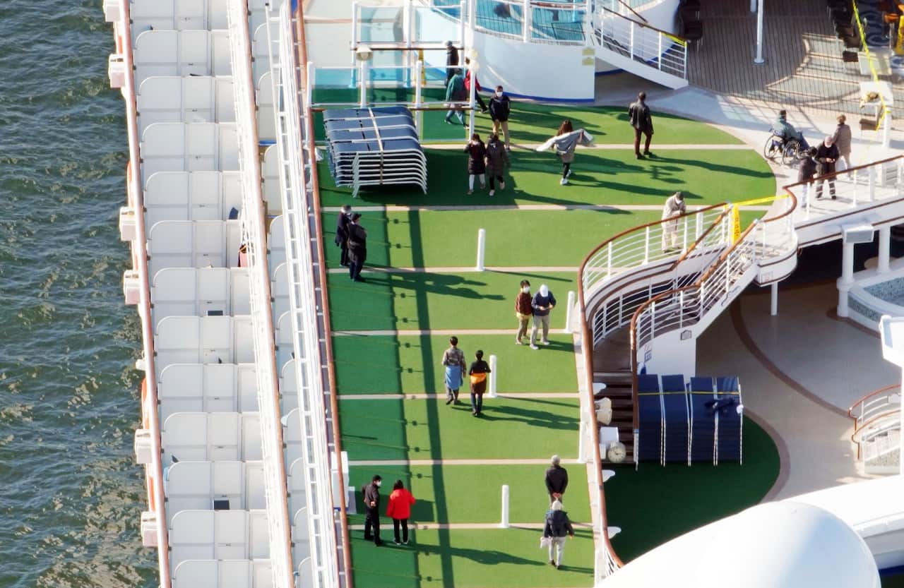 An aerial photo shows passengers on the deck of  the Princess Diamond.
