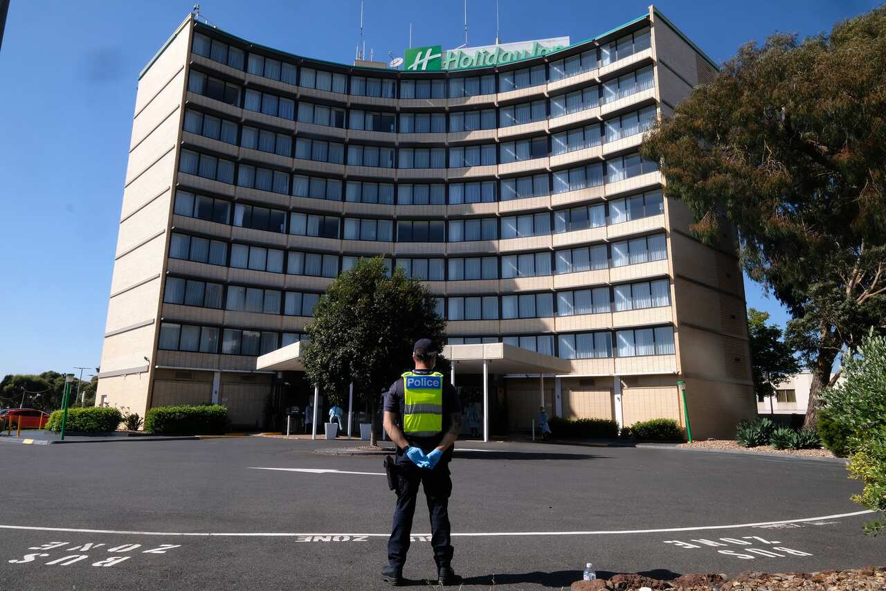Quarantining hotel guest at the Holiday Inn near the  Airport are moved to a new location in Melbourne on 10 February, 2021. 
