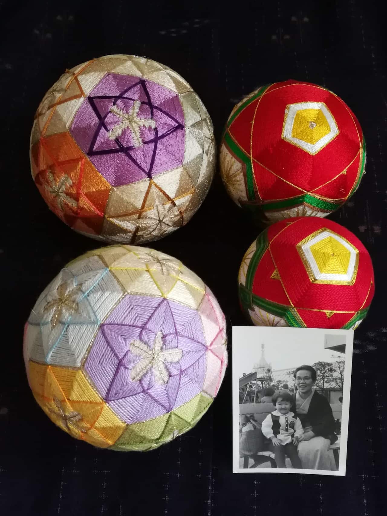 Two Japanese temari balls (bottom) were made by a Sydney-based Japanese artist Chihiro Kownacki.  The two at the top were made by her grandmother.