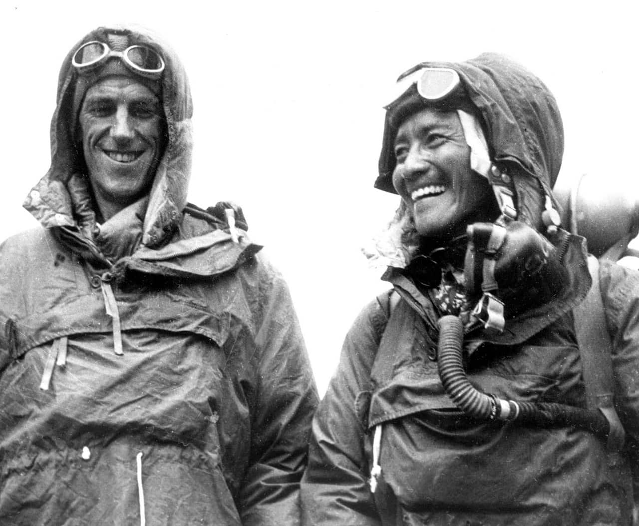 Tenzing Norgay, right, of Nepal and Edmund Hillary of New Zealand stand in the gear they wore when conquering Mount Everest at the British Embassy in Katmandu.