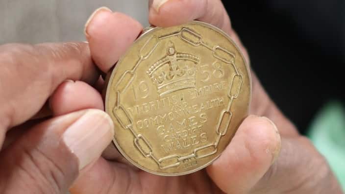 Chaudhry Ashraf holds the gold medal he won 62 years ago at the 1958 Commonwealth games, Cardiff, Wales.