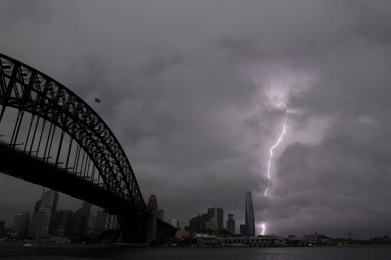 Storm clouds and lightning are seen in Sydney, Thursday, October 14, 2021. (AAP Image/Dan Himbrechts) NO ARCHIVING