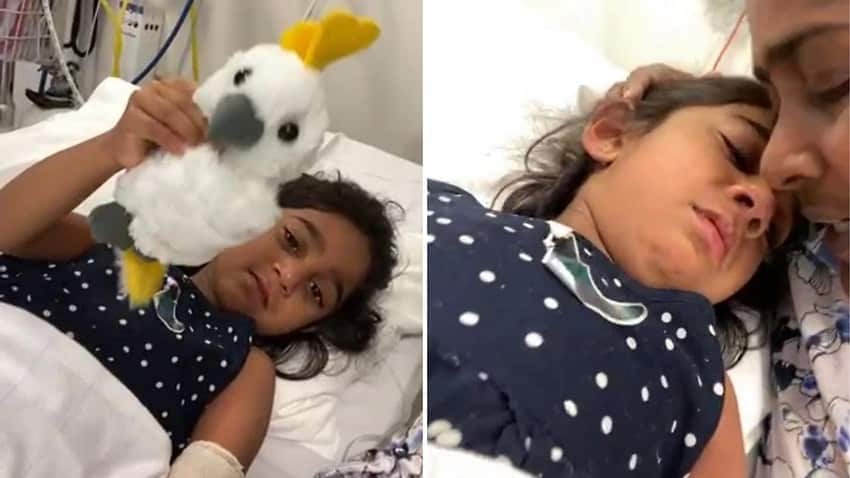 Tharnicaa, 4, and her mother Priya, facetime family friend Angela Fredericks from hospital in Perth