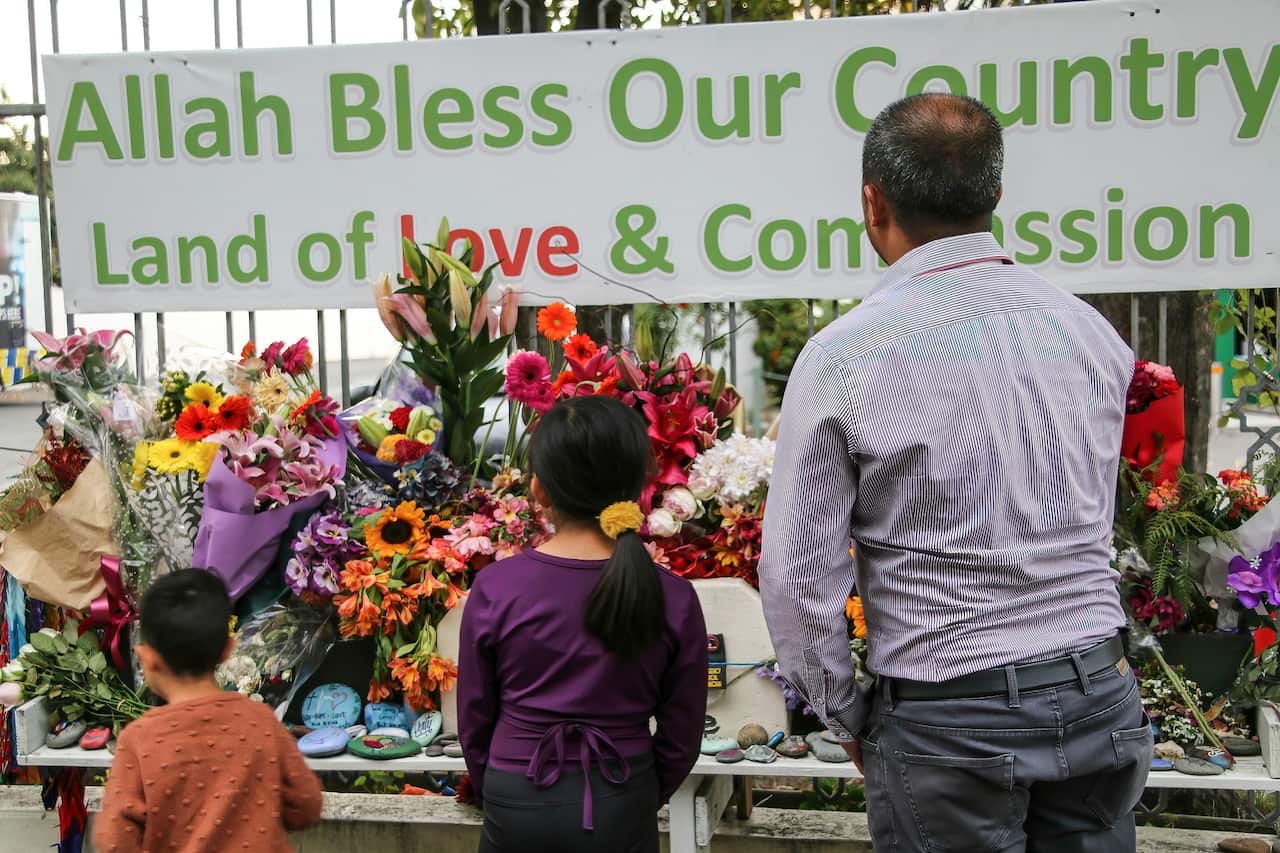 New Zealanders place flowers outside the Al-Noor Mosque on second anniversary of the 2019 attacks.