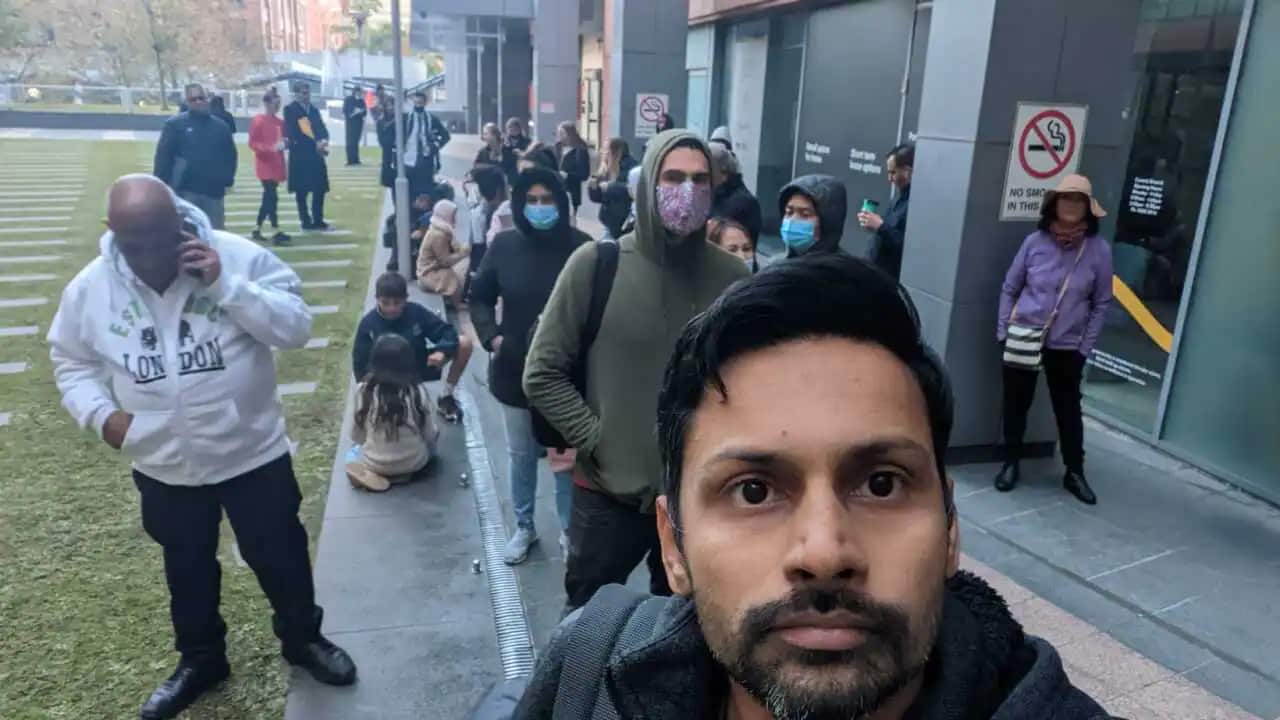 Sreenith Kulangarath outside the Sydney passport office where hundreds of people queued up on Tuesday to collect their new passports.