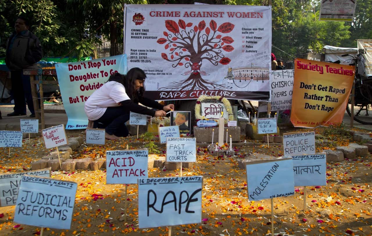 A woman pays respect on the second anniversary of the deadly gang rape of a student on a bus in New Delhi. The case sparked public outrage and helped make women’s safety a common topic of conversation