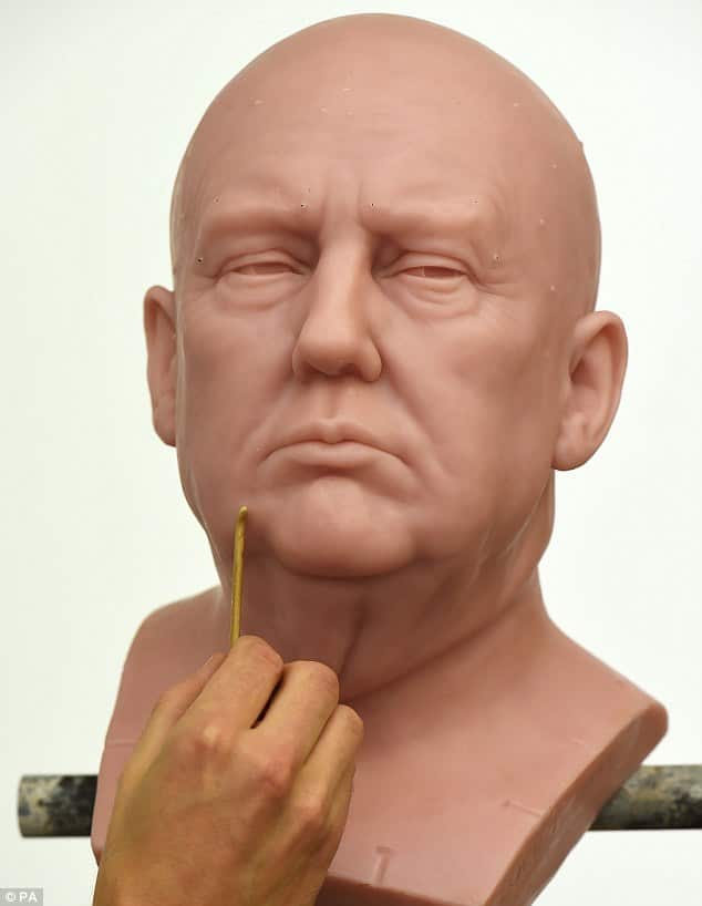 Madame Tussauds sculptor David Gardner works on an unfinished wax figure of Trump at the museum's west London studio in this photo released on Wednesday