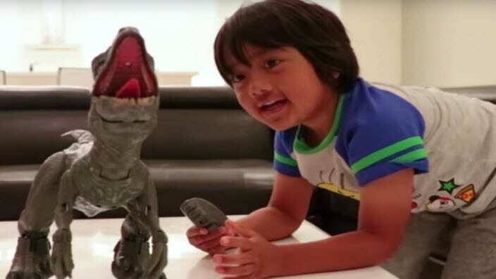 Youtuber reviews a dinosaur toy.