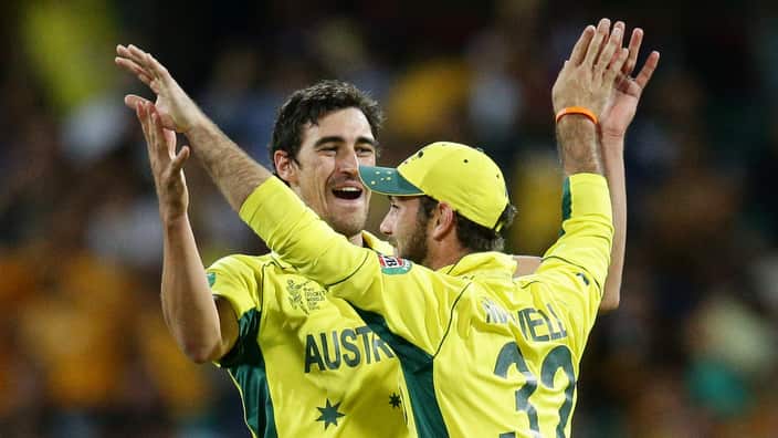 Australia's Glenn Maxwell is congratulated by teammate Mitchell Starc, left, after running out India's MS Dhoni during their Cricket World Cup semifinal in Sydney, Australia, Thursday, March 26, 2015. (AP Photo/Rob Griffith)