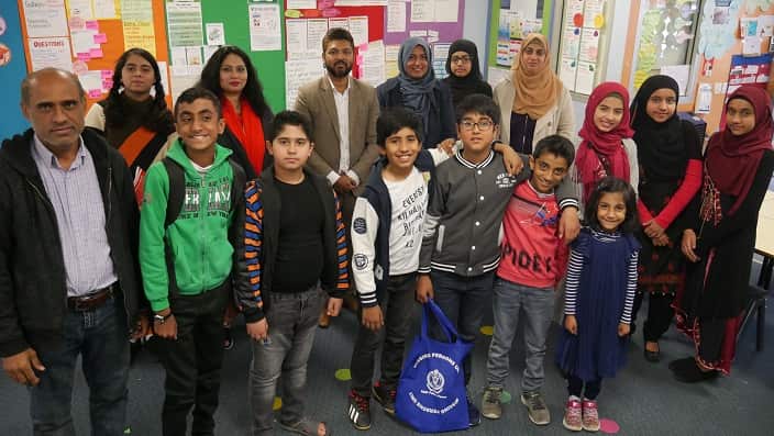 Students, parents and teachers at Urdu school at Lakemba, Sydney share a moment.