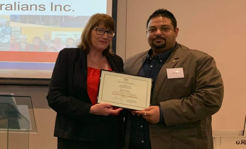 Amit Singh Jadaun (R) receives certificate for his contribution for the society.