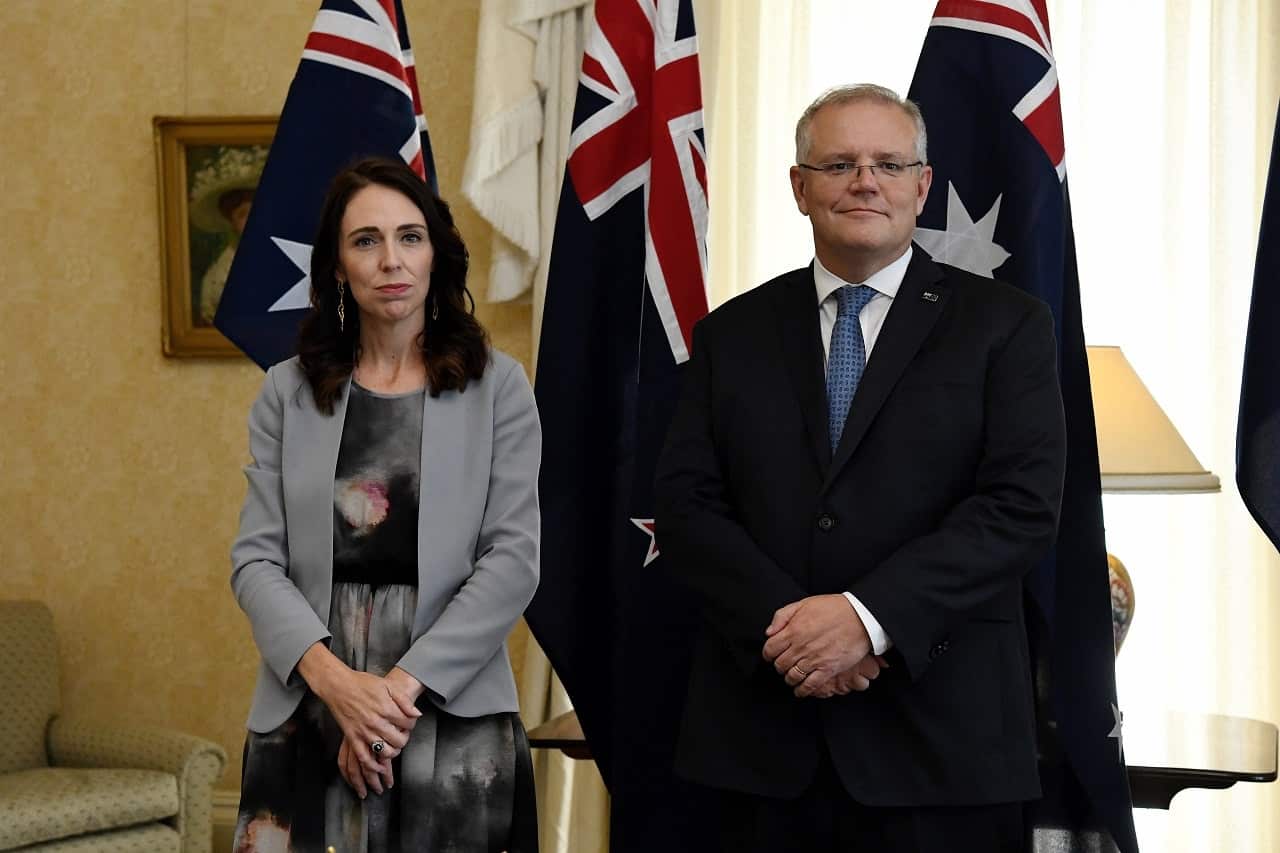 New Zealand Prime Minister Jacinda Ardern stands with Australian Prime Minister Scott Morrison in 2020.