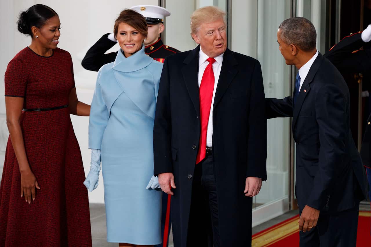 President Barack Obama and first lady Michelle Obama greet President-elect Donald Trump and Melania Trump at the White House, Friday, Jan. 20, 2017, in Washington. (AP Photo/Evan Vucci)