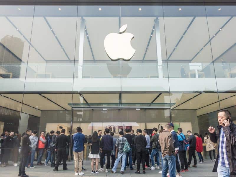 Customers in front of an Apple store in China