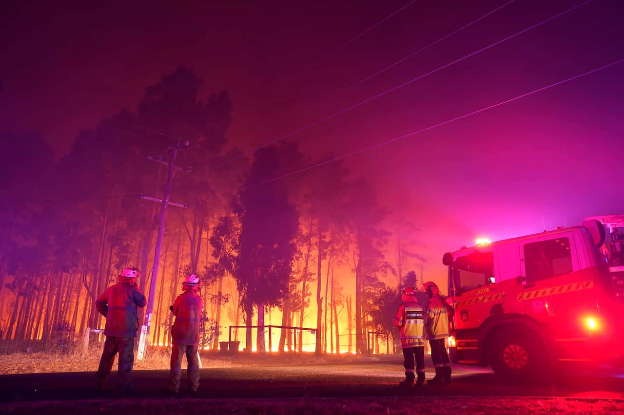 Firefighters attend the fire at Wooroloo, near Perth on Monday, 1 February.