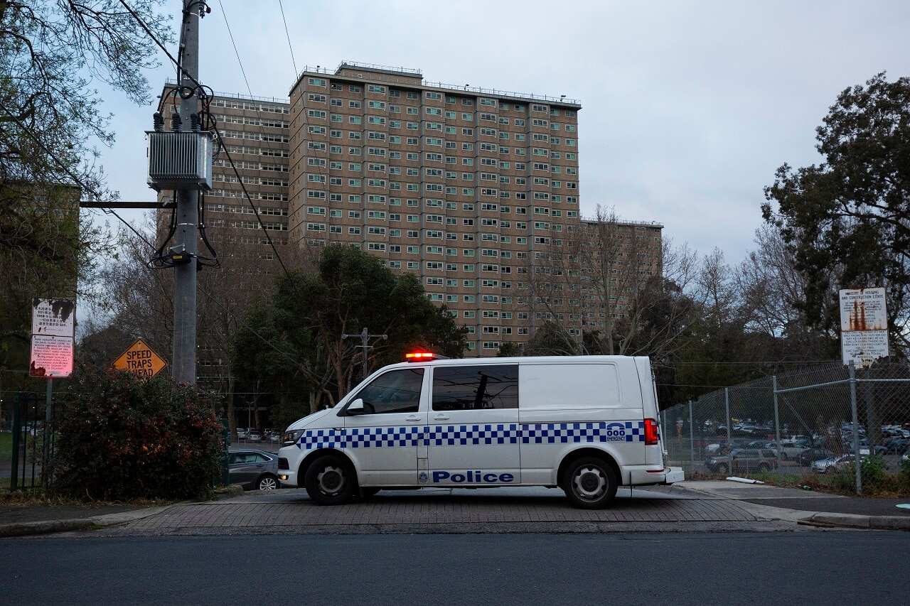 Police patrols outside public housing towers on Racecourse Road in Flemington.