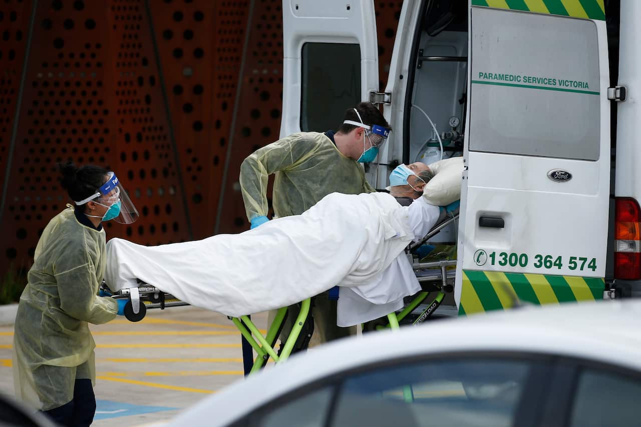 A resident is taken away in an ambulance from Epping Gardens Aged Care Facility in Epping, Melbourne, Tuesday, July 28, 2020