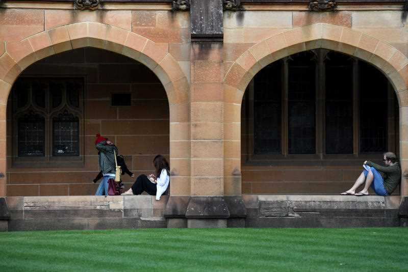 Students read at the Quadrangle of the University of Sydney in Sydney on Tuesday, May 2, 2017.