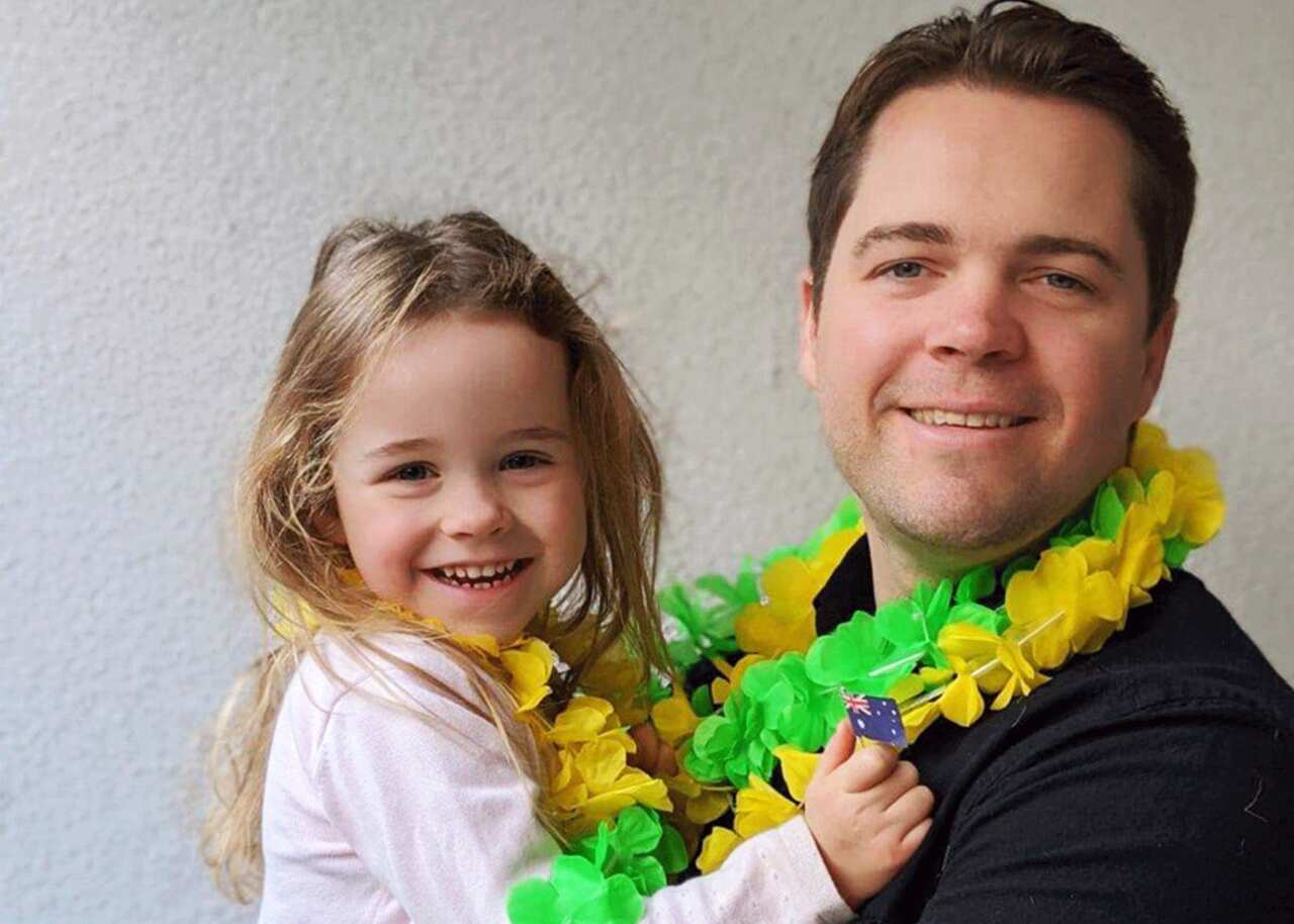 Richard Farmer and his daughter Imogen after they became Australian citizens at home. 