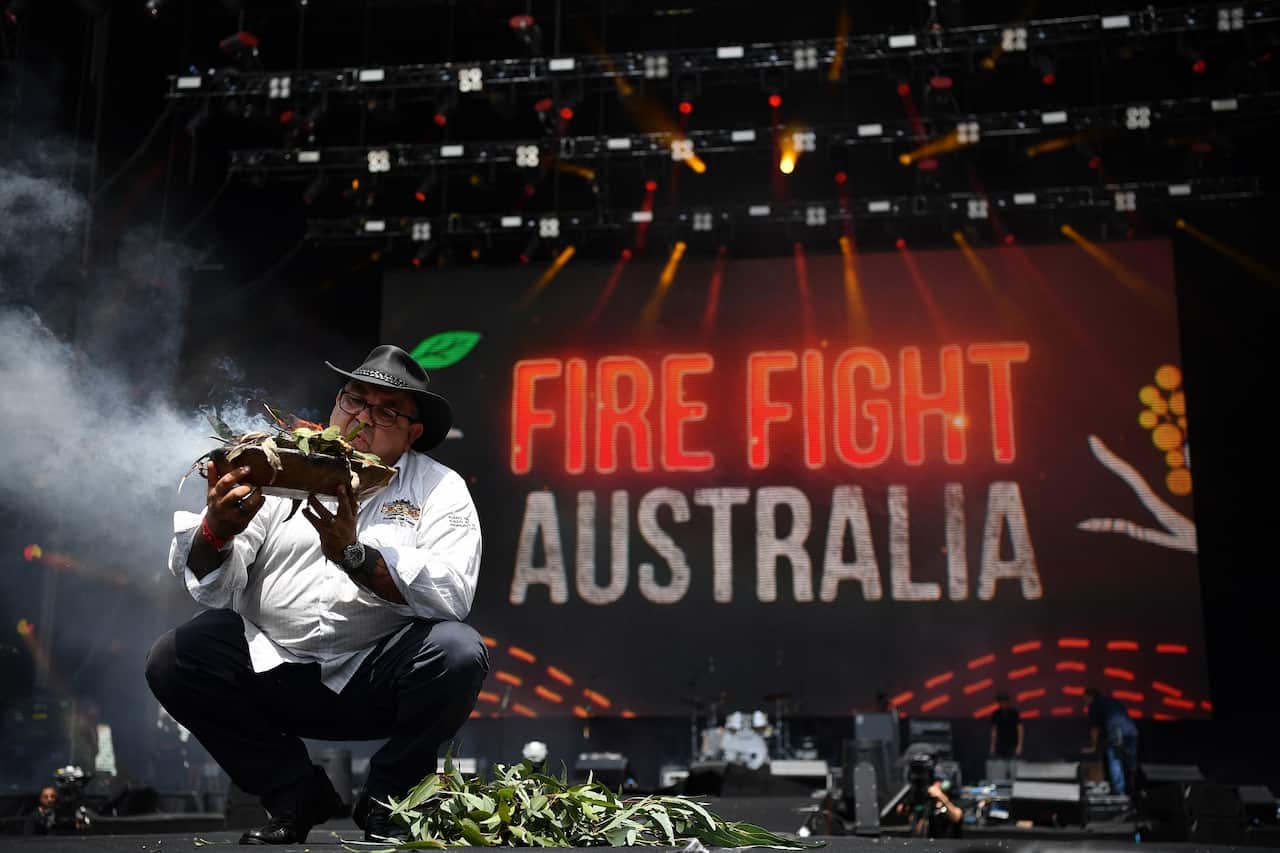 A traditional smoking ceremony during the Fire Fight Australia bushfire relief concert.