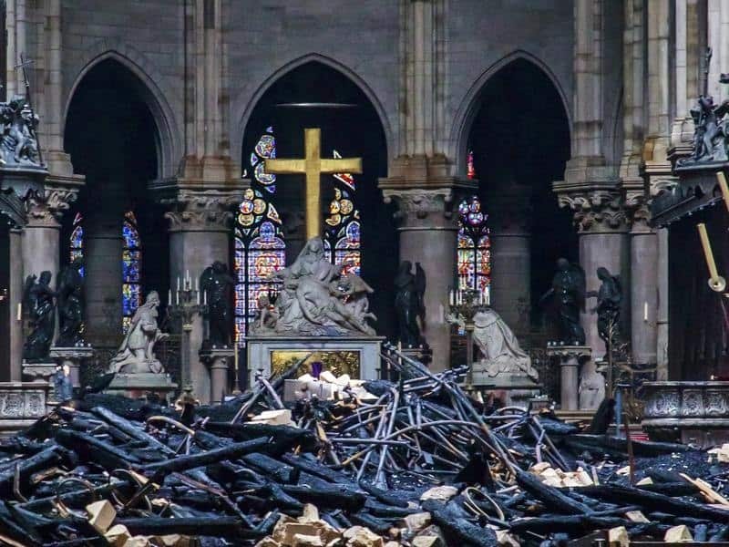 Debris are seen inside Notre-Dame cathedral