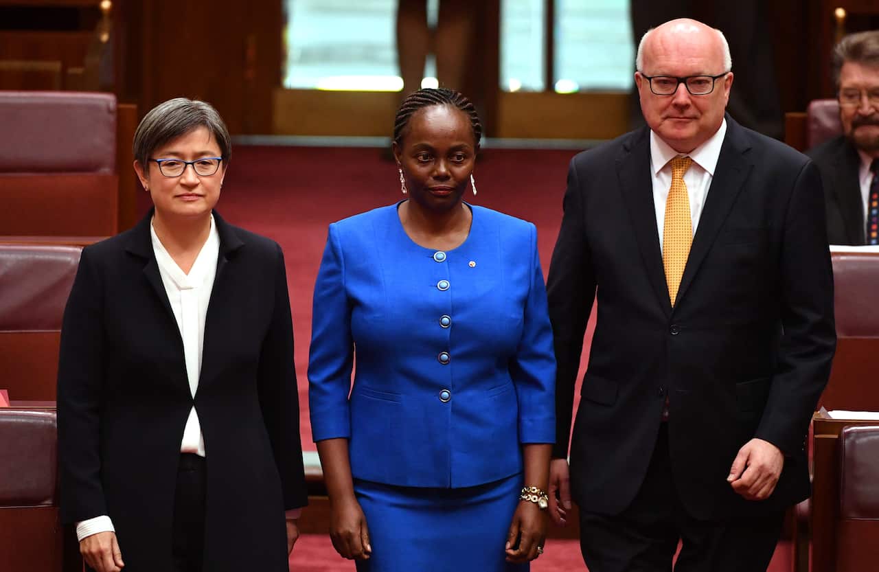 Lucy Gichuhi, centre, arrives for her swearing in ceremony at Parliament House in Canberra on 9 May 2017.