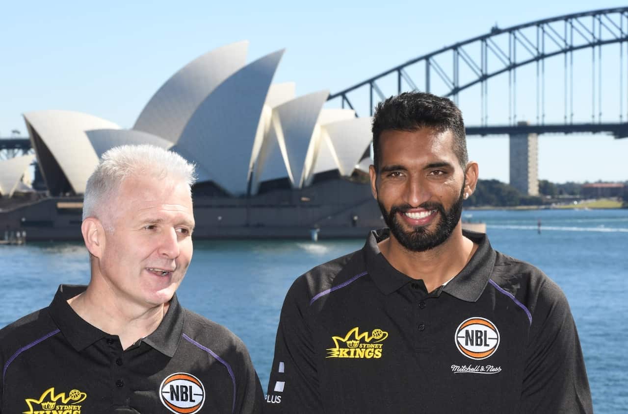 Sydney Kings National Basketball League signing Amritpal Singh (right) and Sydney Kings coach Andrew Gaze pose for photographs