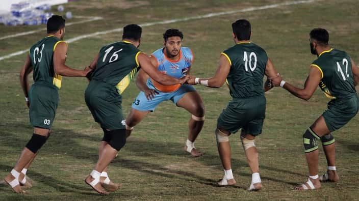 Pakistani (green) and Indian Kabaddi players in action during the final of the Kabaddi World Cup between Pakistan and India, in Lahore, Pakistan, 16 February 20