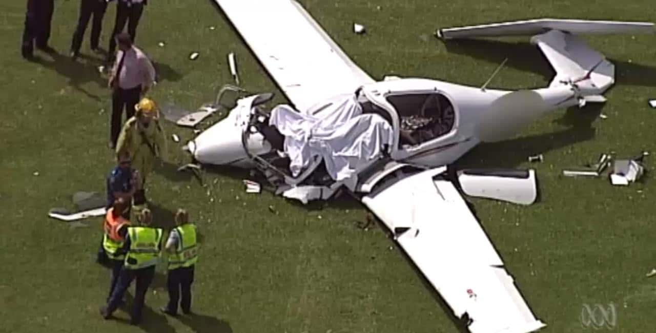 Two people are dead after a light plane crash in southeast Queensland with photos from the scene showing the wreckage lying on grass.