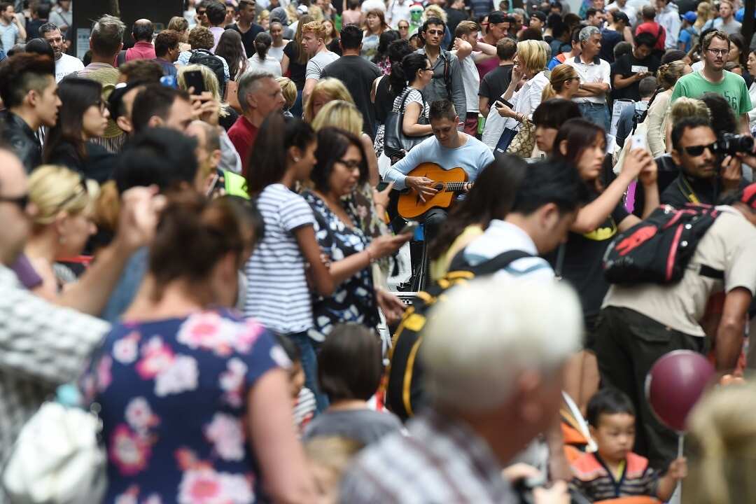Huge crowds fill Pitt Street Mall and the CBD shopping district as they purchase their last minute christmas gifts on Christmas Eve in Sydney, Wednesday, Dec. 24, 2014. (AAP Image/Dean Lewins) NO ARCHIVING