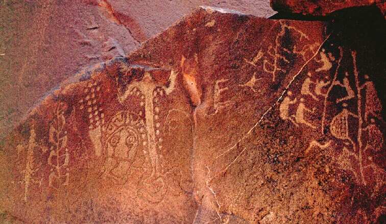 Ancient Aborignal rock art coined ‘Climbing Men Panel’ found amongst thousands of drawings and carvings near the Burrup Peninsula in Western Australia.