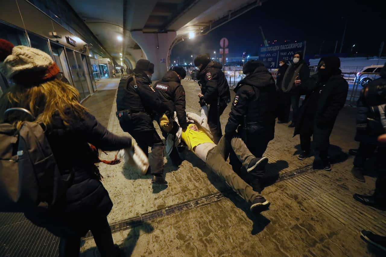 Police officers detain a supporter of Russian opposition leader Alexei Navalny at the Vnukovo International Airport in Moscow, Russia, on 17 January.