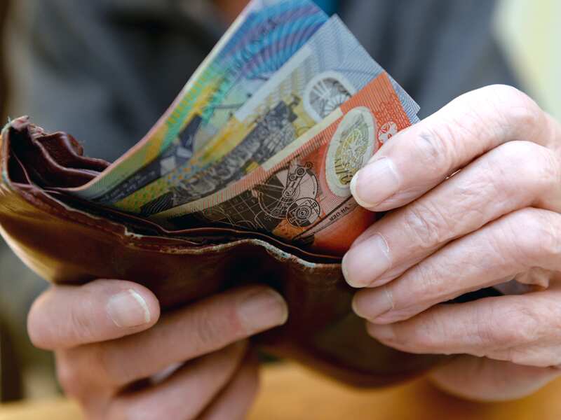 Money is taken out of a wallet