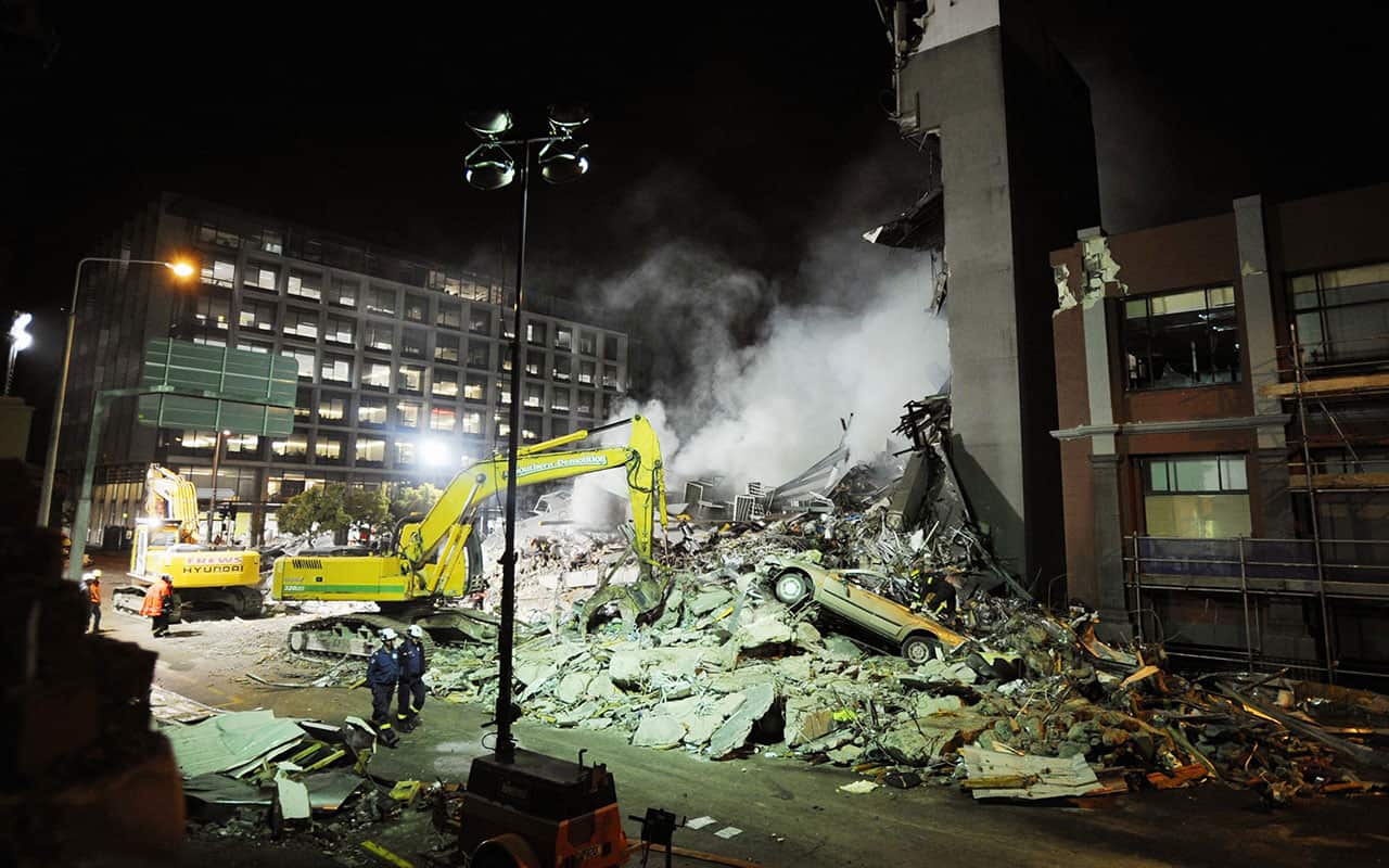 Rescue workers search for victims buried under the rubble near the Canterbury Television building in Christchurch, New Zealand, Wednesday night, Feb. 23, 2011. 