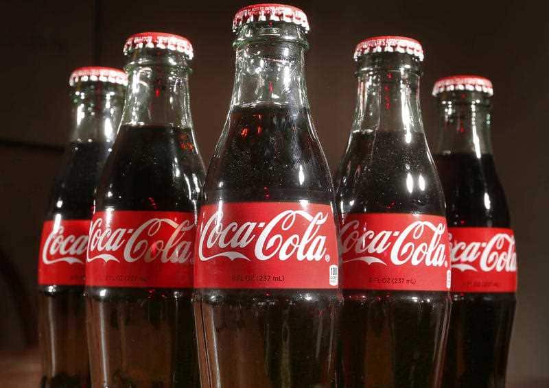 This April 28, 2016, file photo shows bottles of Coca-Cola in Concord, N.H.