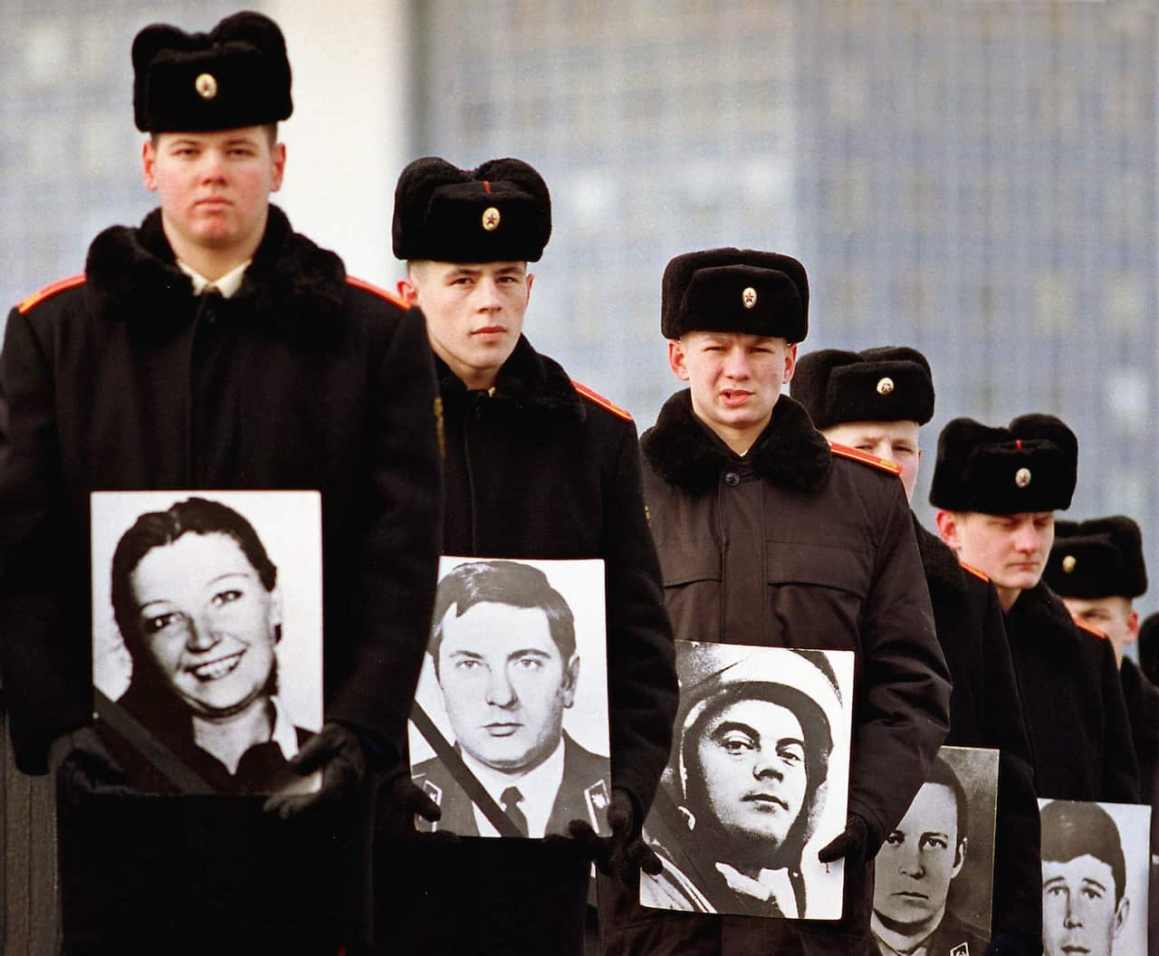 Young cadets hold portraits of Soviet military servicemen killed in the war in Afghanistan, during memorial ceremonies in Minsk,  15 February 2000. on the 11th anniversary of the Soviet Army's departure from Afghanistan.