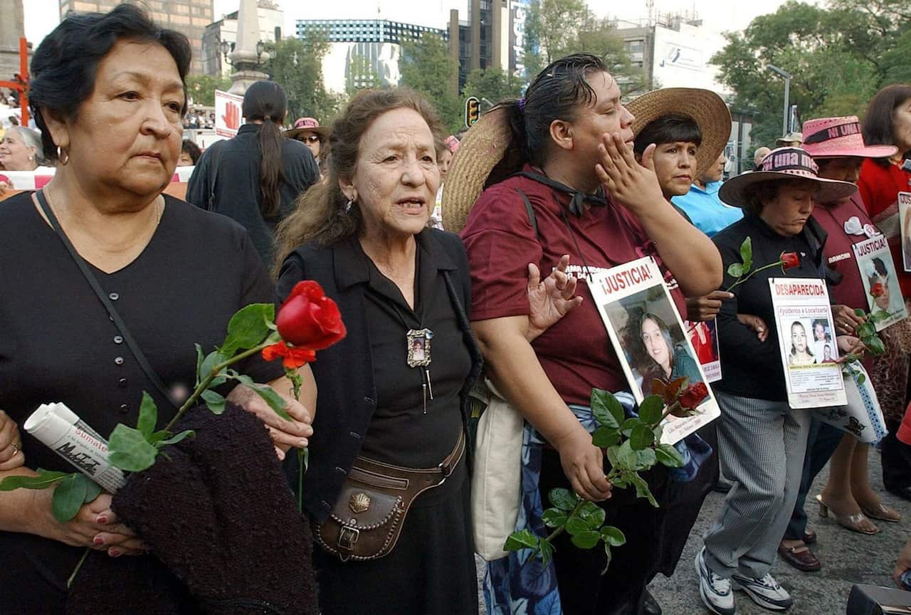 Mexican activist Rosario Ibarra (2nd L) leads the group of mothers of women who disappeared or have been found murdered in the Mexican border city of Ciudad Juarez on Tuesday 25 November 2003