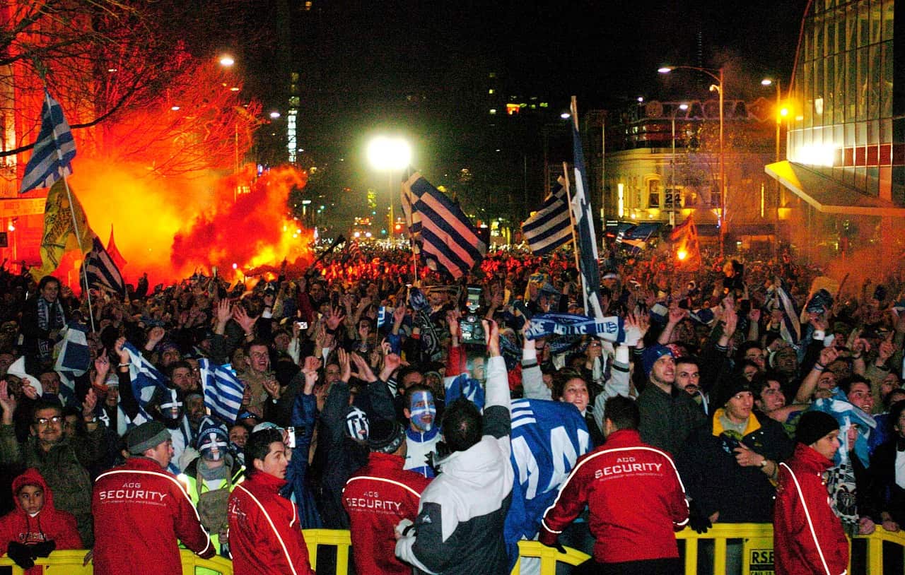 Greek-Australian soccer fans celebrate victory in Euro 2004 in Lonsdale Street in Melbourne, July 5th 2004.