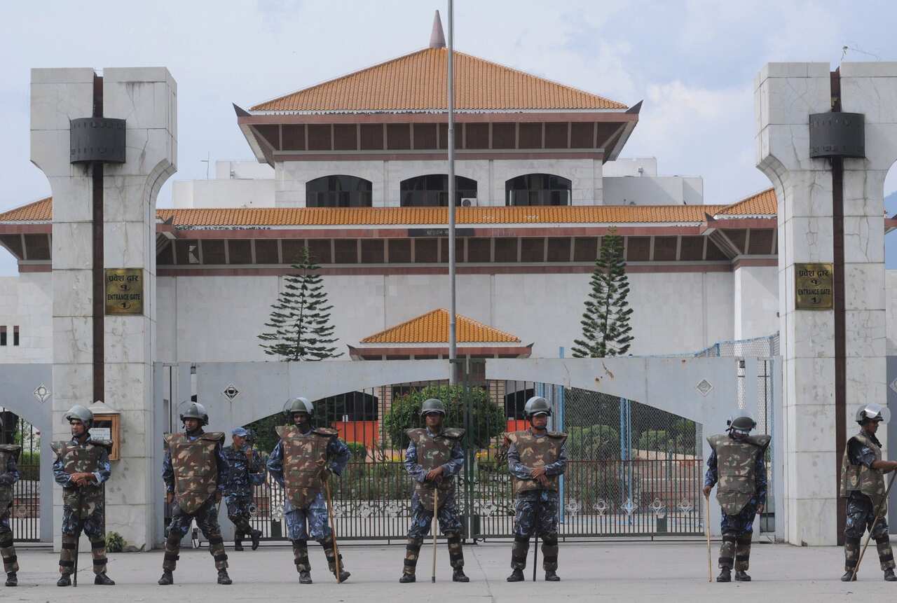 Nepali riot police stand guard in front of the federal parliament building in Baneshwore, Kathmandu.