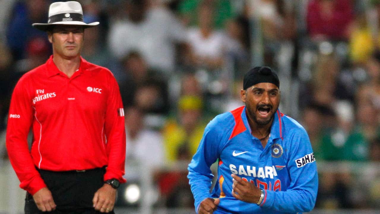 India's bowler Harbhajan Singh, right, reacts after his delivery as umpire Simon Taufel of Australia, left, looks on during the One Day cricket match.