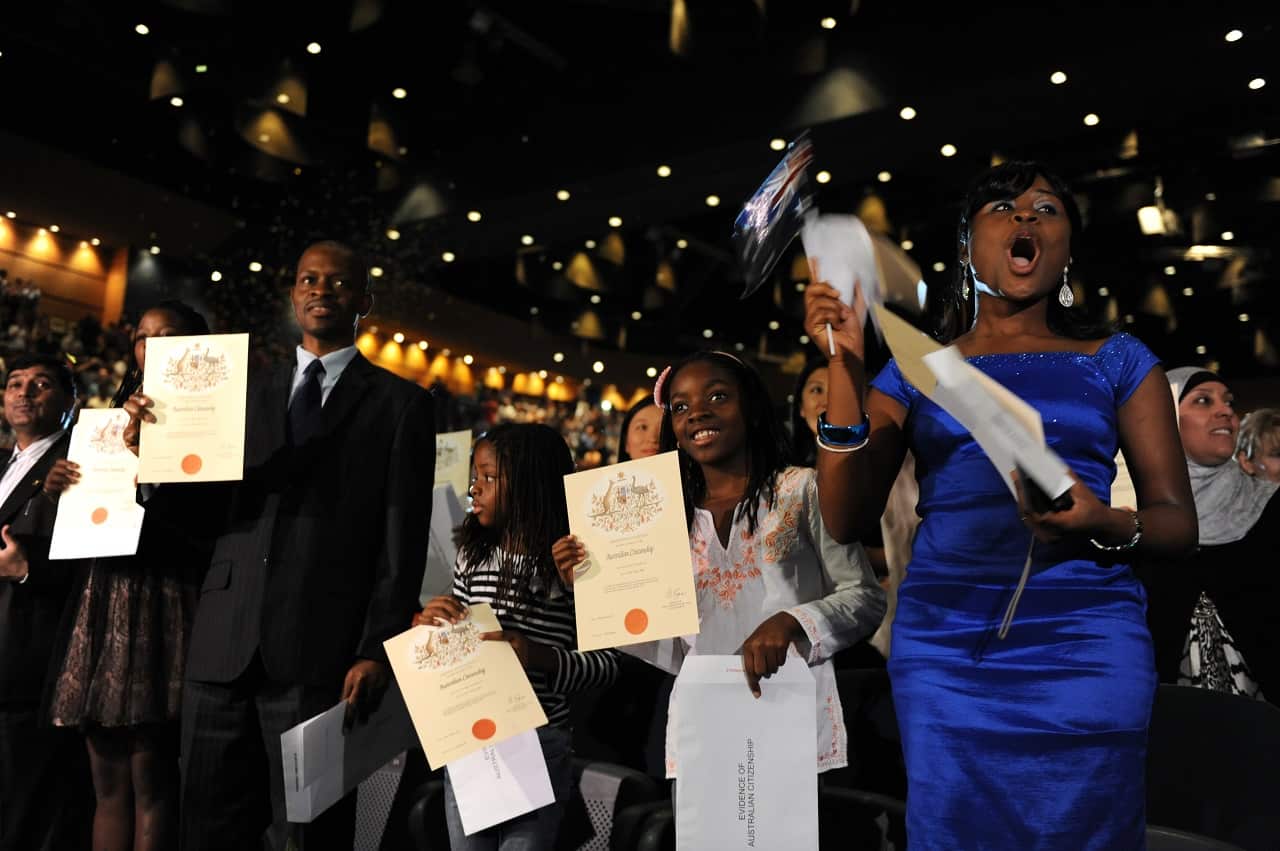 New citizens participate in citizenship ceremony on Australia Day in Brisbane. 