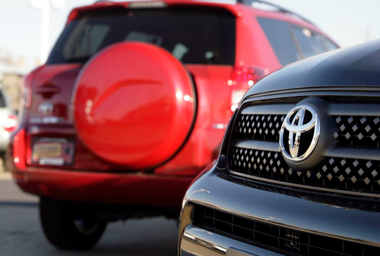 FILE- In this Nov. 26, 2006, file photo, unsold 2007 RAV4 sports-utility vehicles are shown on the lot of a Toyota agency in the east Denver suburb of Aurora, Colo. The U.S. government said Monday, June 18, 2012, that it has expanded an investigation into