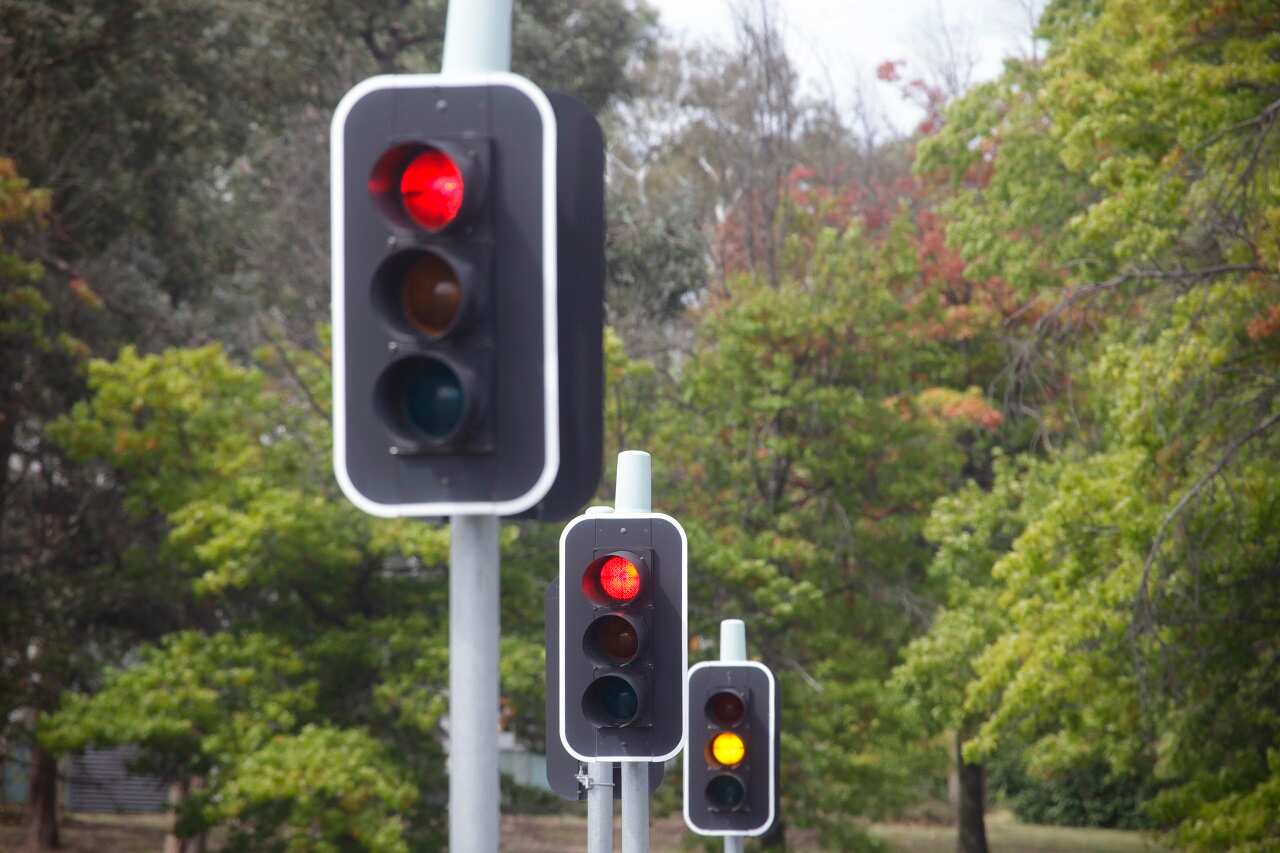 Three traffic lights are seen in Canberra, Tuesday, March 26. 2013. (AAP Image/Lukas Coch) NO ARCHIVING