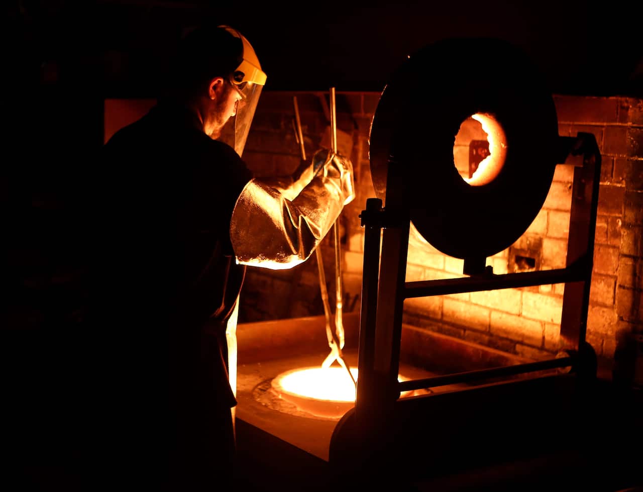 **FILE** A Wednesday, April. 24, 2013 file photo of samples of a gold pour photographed at The Perth Mint in Perth. (AAP Image/Theron Kirkman) NO ARCHIVING