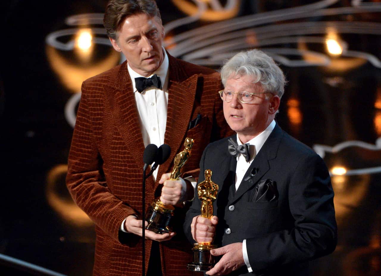 Malcolm Clarke (right) accepted the award for best short subject documentary of the year during the Oscars in 2014.