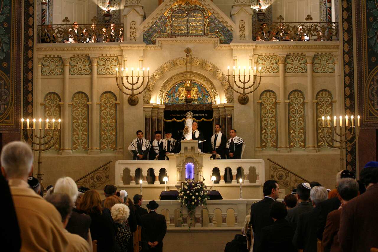 Rabbis carry the Torah scrolls in a solemn procession during the reopening after renovation of Germany's biggest synagogue at the Rykestrasse in Berlin