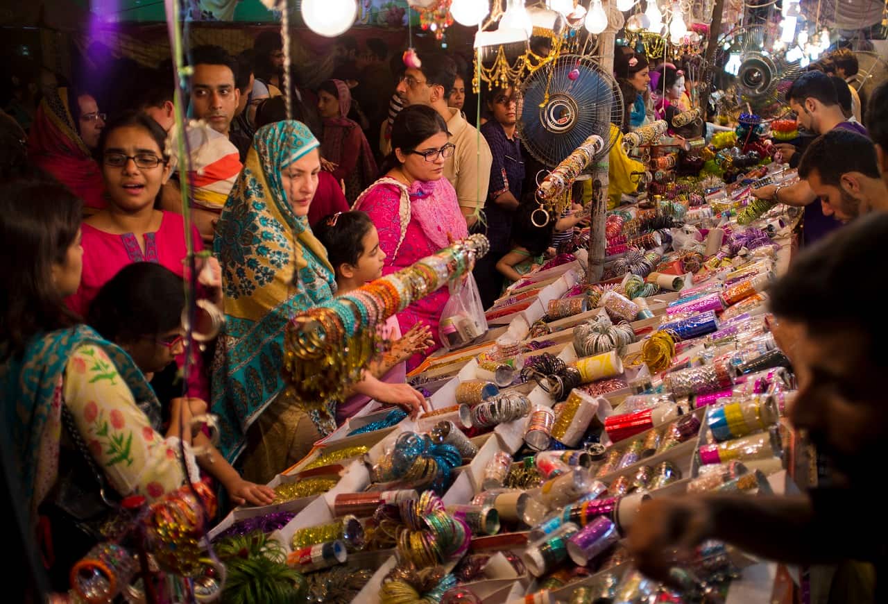 Pakistani customers buy bangles ahead of the Muslim holiday of Eid al-Fitr in Islamabad, Pakistan.