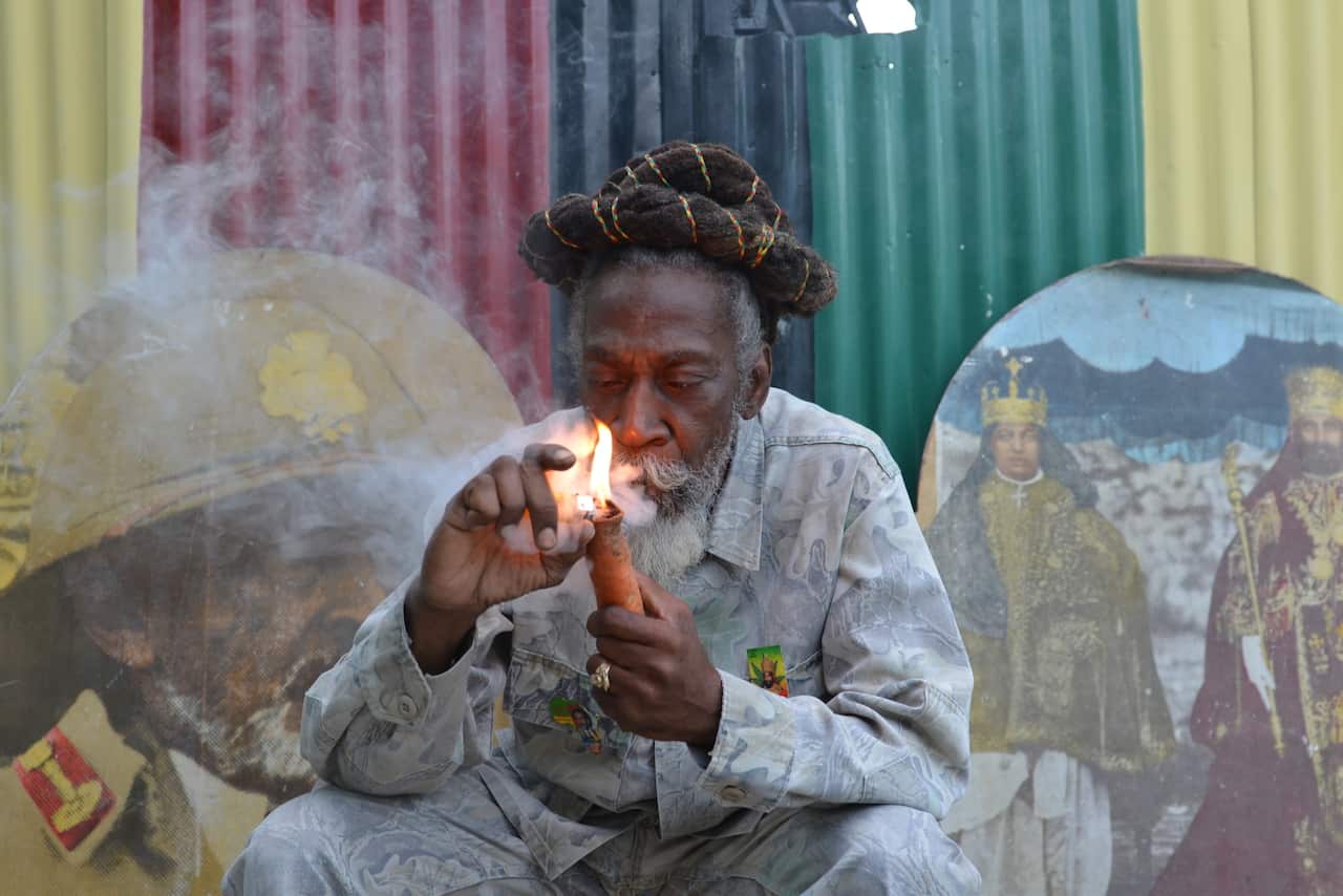 Rastafarian Bunny Wailer smokes marijuana