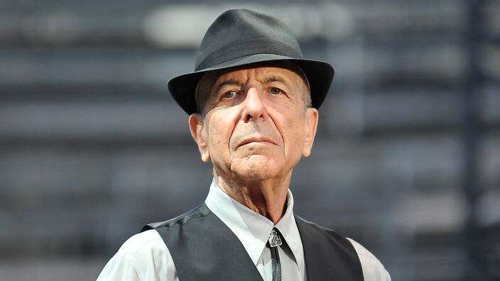 Leonard Cohen performing on stage in the arena in Nimes, France